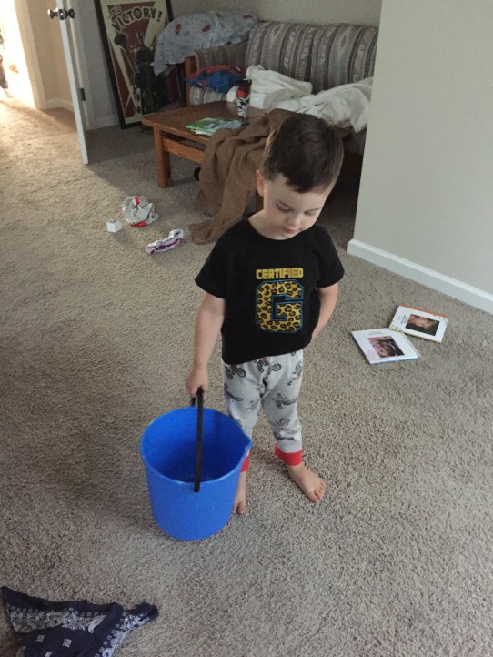 Cormac carrying around his throw up bucket
